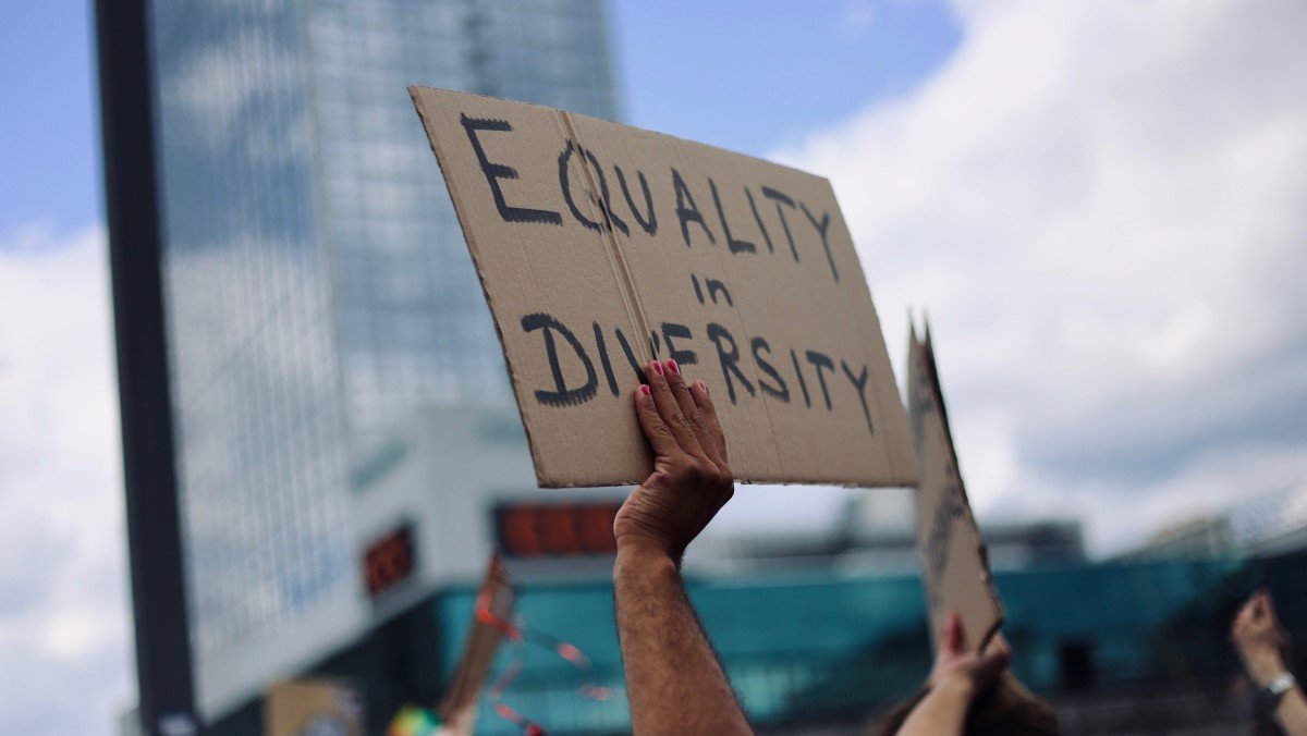 Crowd demanding greater equality through diversity