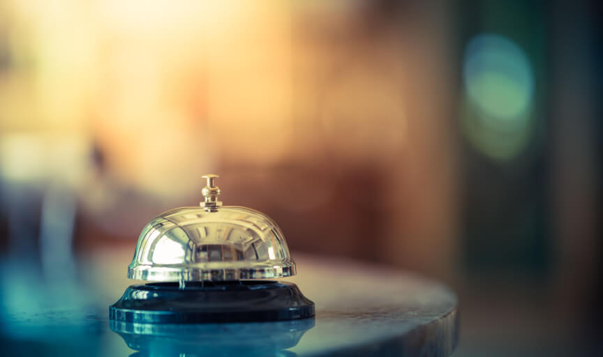 Close up photograph of a hotel reception counter bell.