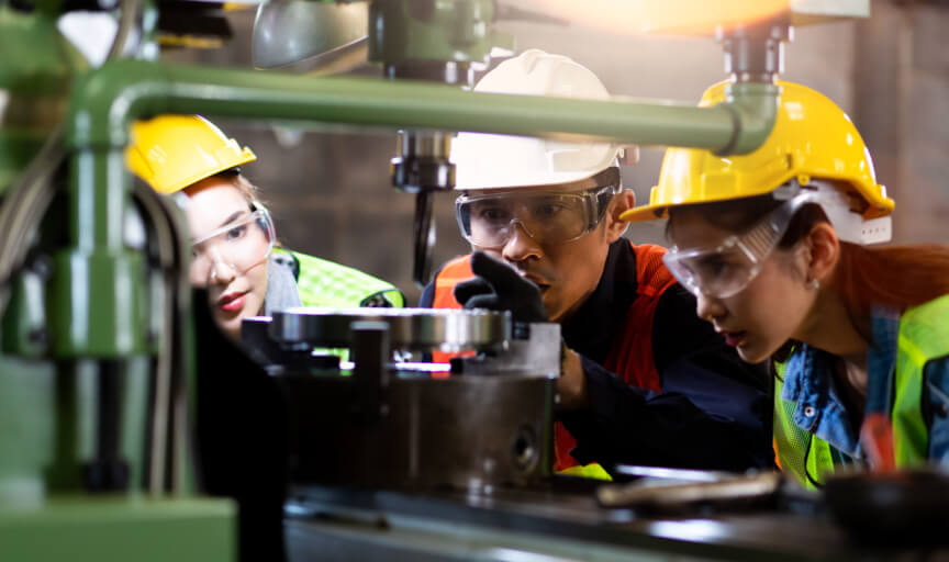 Training session taking place in an industrial setting.