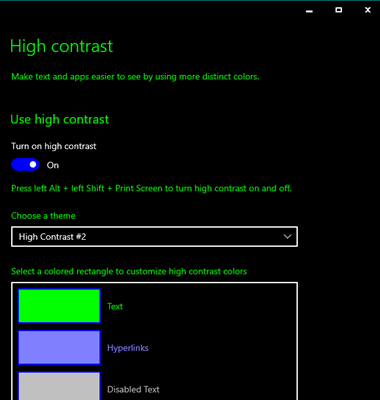 Screenshot depicts an example of one of the Windows high contrast default themes. The background is set to black with luminous green body text with white and green keylines.